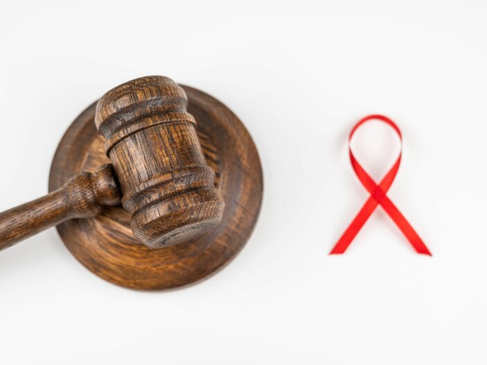 Judicial,Gavel,And,Red,Ribbon,On,A,White,Background.,Symbol